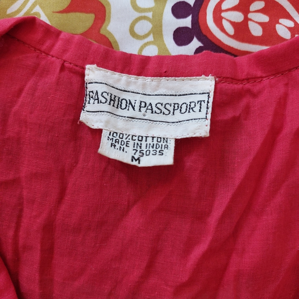 Red ruffled lace-up blouse